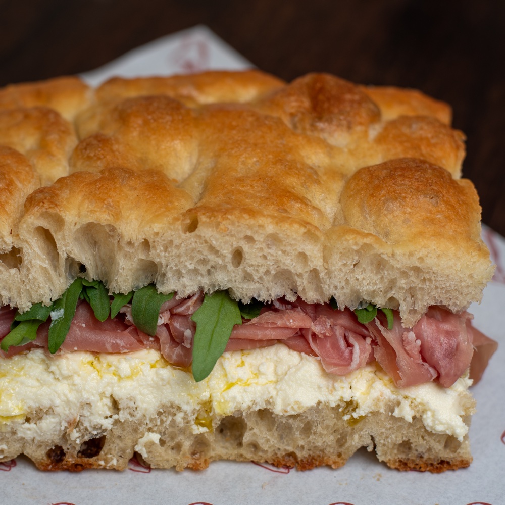 Focaccia filled with Parma ham, rocket and stracchino