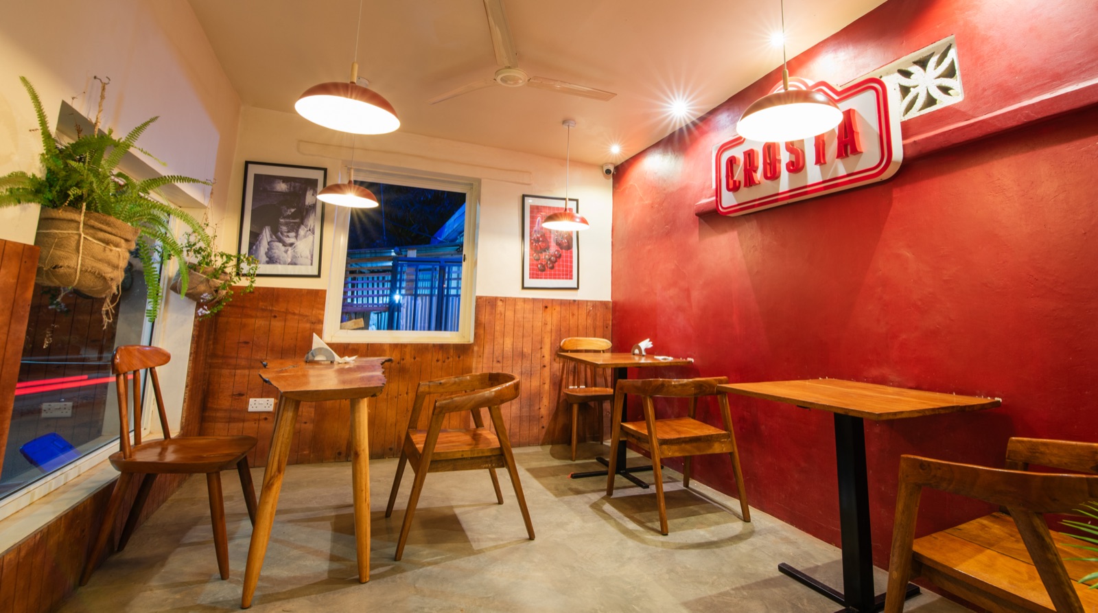 The red wall room with tables set for dinner