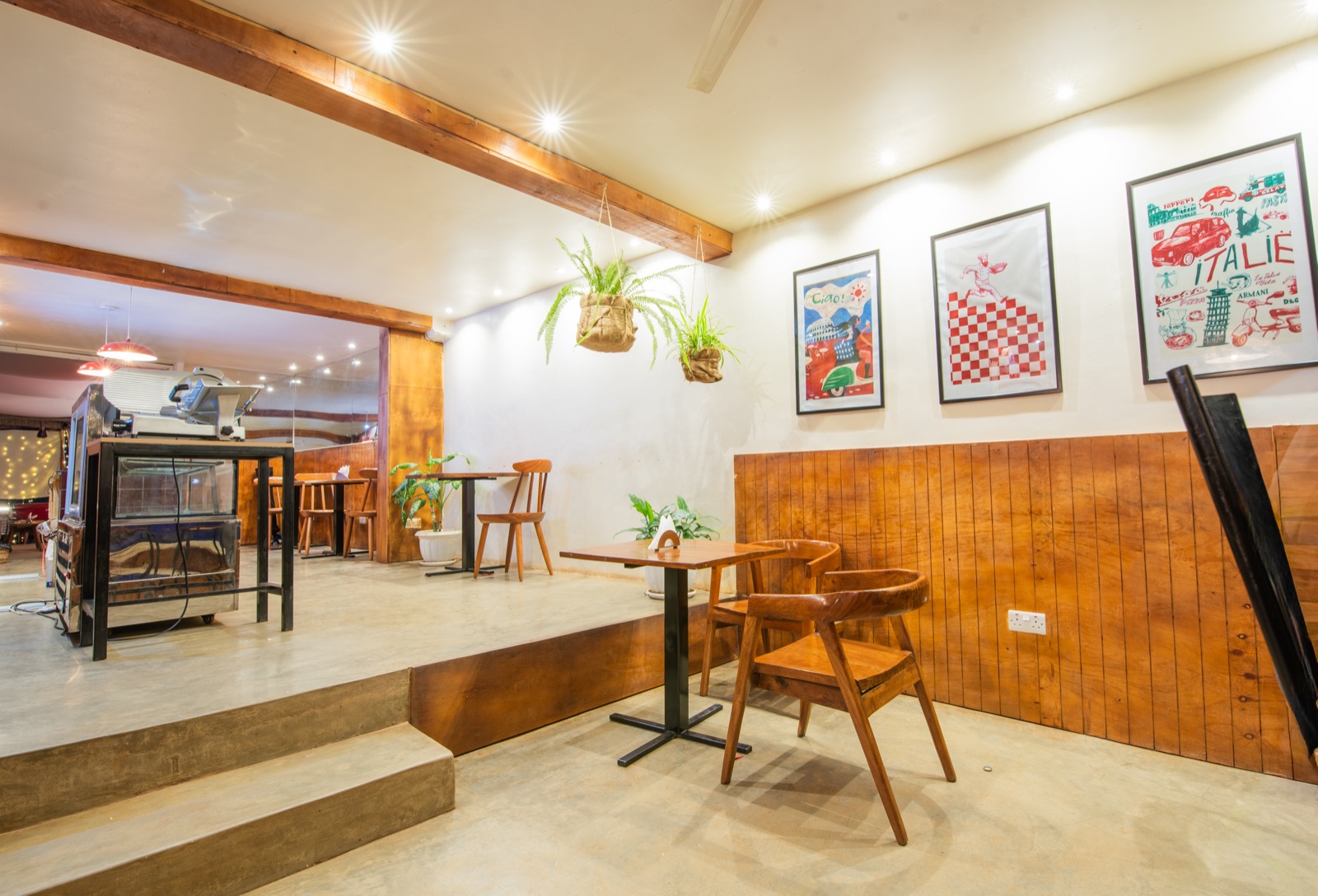 Wooden dining room with Italian prints on the wall