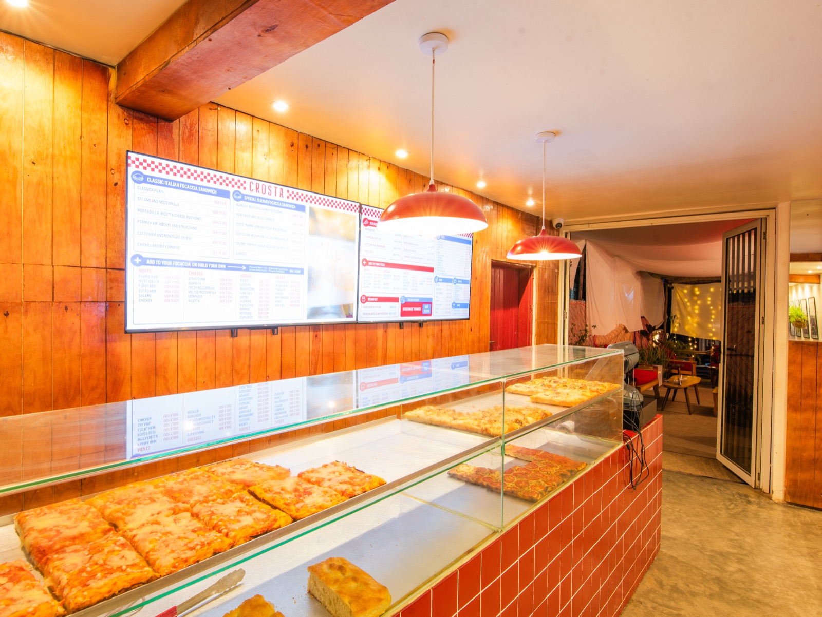 The display counter with fresh focaccia behind glass